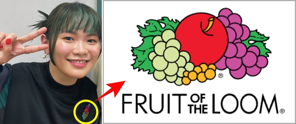 緑の髪の女性と林檎と葡萄のイラスト